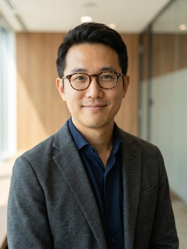 AI-generated example of a Business Casual headshot: blazer with a softly blurred office behind