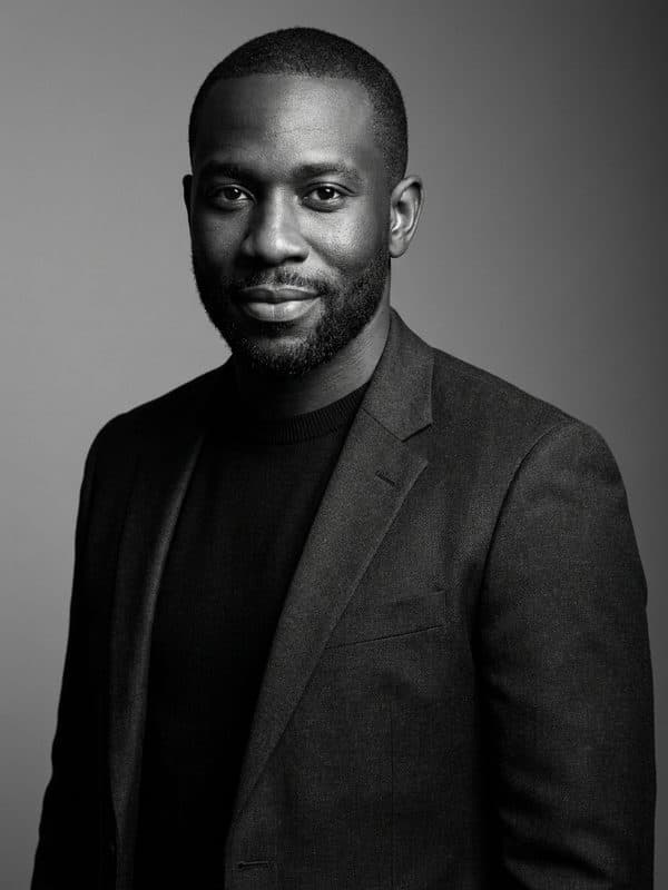 AI-generated example of a B&W Editorial headshot: high-contrast black-and-white magazine-style portrait